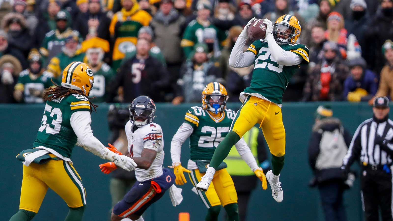 Green Bay Packers safety Xavier McKinney (29) soars high to intercept a pass against the Chicago Bears in the third quarter on Sunday, Jan. 5, 2025, at Lambeau Field in Green Bay, Wis. It was McKinney's career-high eighth interception of the season.