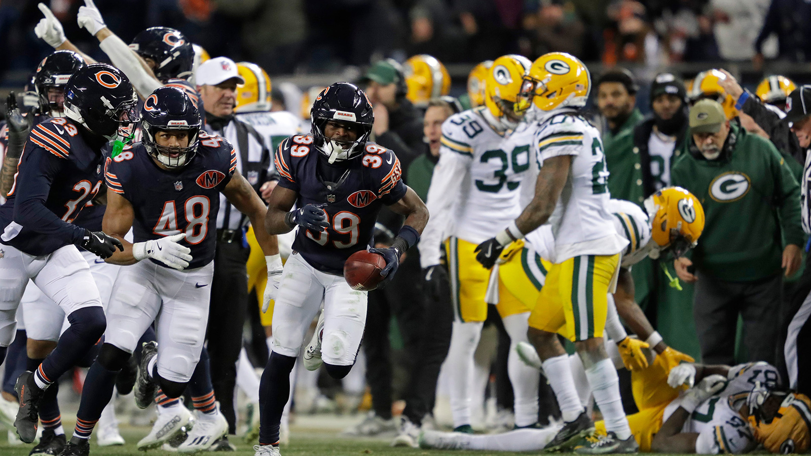 Chicago Bears cornerback Josh Blackwell (39) celebrates recoving an onside kick mishandled by Green Bay Packers wide receiver Romeo Doubs (87) in the fourth quarter during their football game Saturday, December 20, 2025, at Soldier Field in Chicago, Illinois.