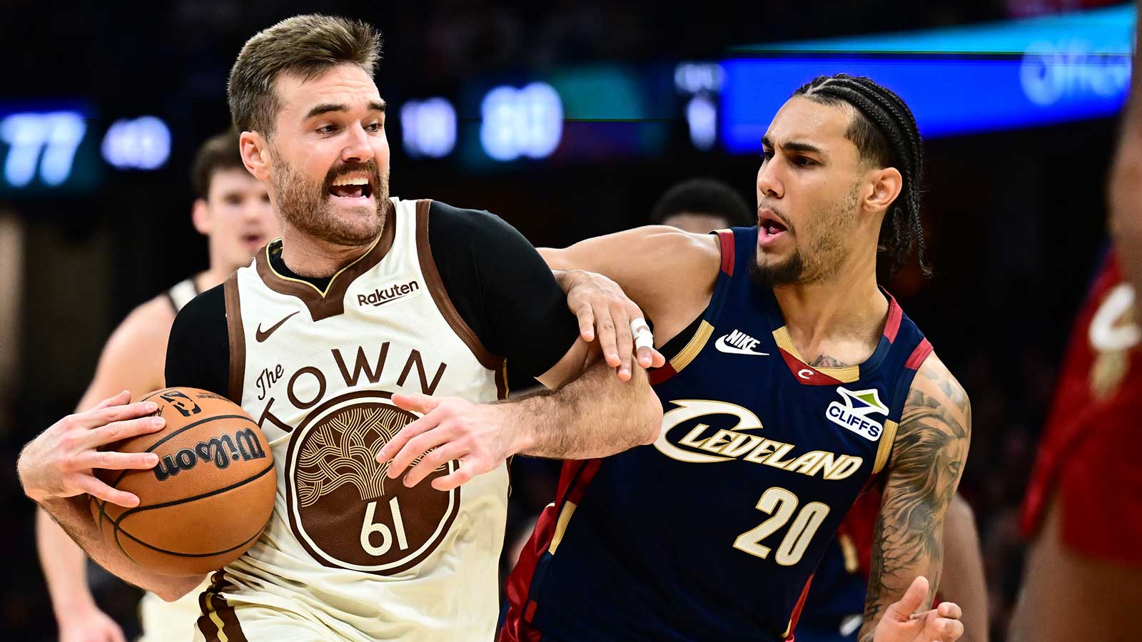 Golden State Warriors guard Pat Spencer (61) drives to the basket against Cleveland Cavaliers guard Jaylon Tyson (20) during the second half at Rocket Arena.