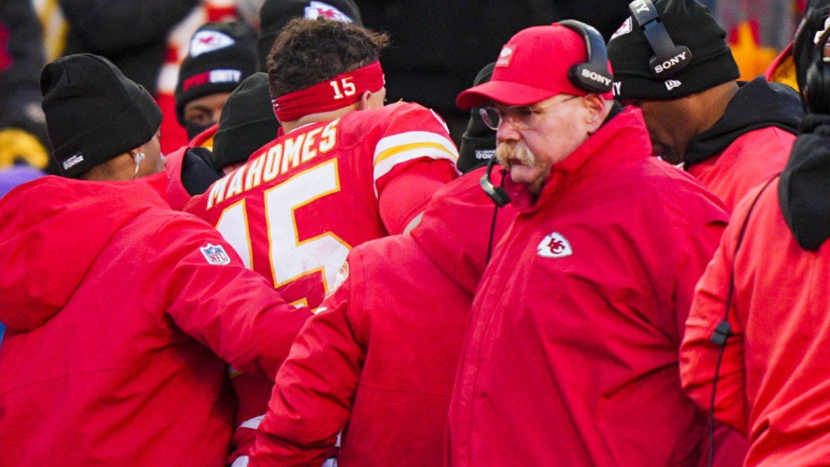 Kansas City Chiefs quarterback Patrick Mahomes (15) is attended to by team medical staff following an injury during the fourth quarter against the Los Angeles Chargers at GEHA Field at Arrowhead Stadium. Kansas City Chiefs head coach Andy Reid, second from right, stands on the sideline
