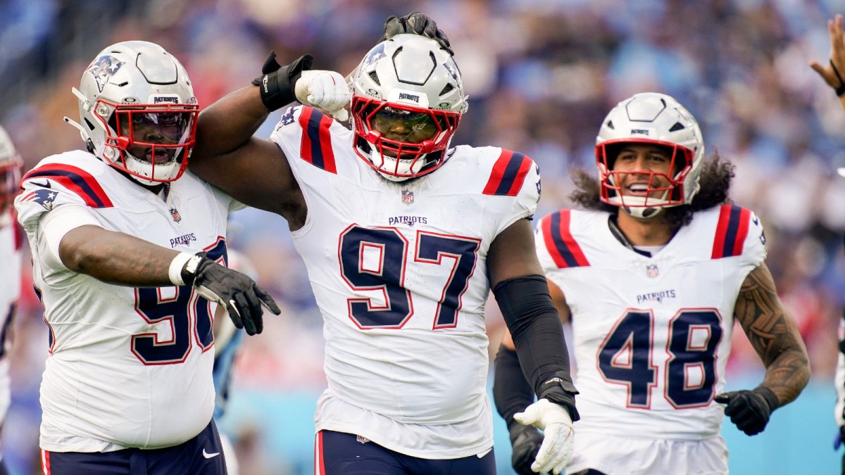 New England Patriots defensive end Milton Williams (97) celebrates sacking Tennessee Titans quarterback Cam Ward (1) during the third quarter at Nissan Stadium in Nashville, Tenn., Sunday, Oct. 19, 2025.
