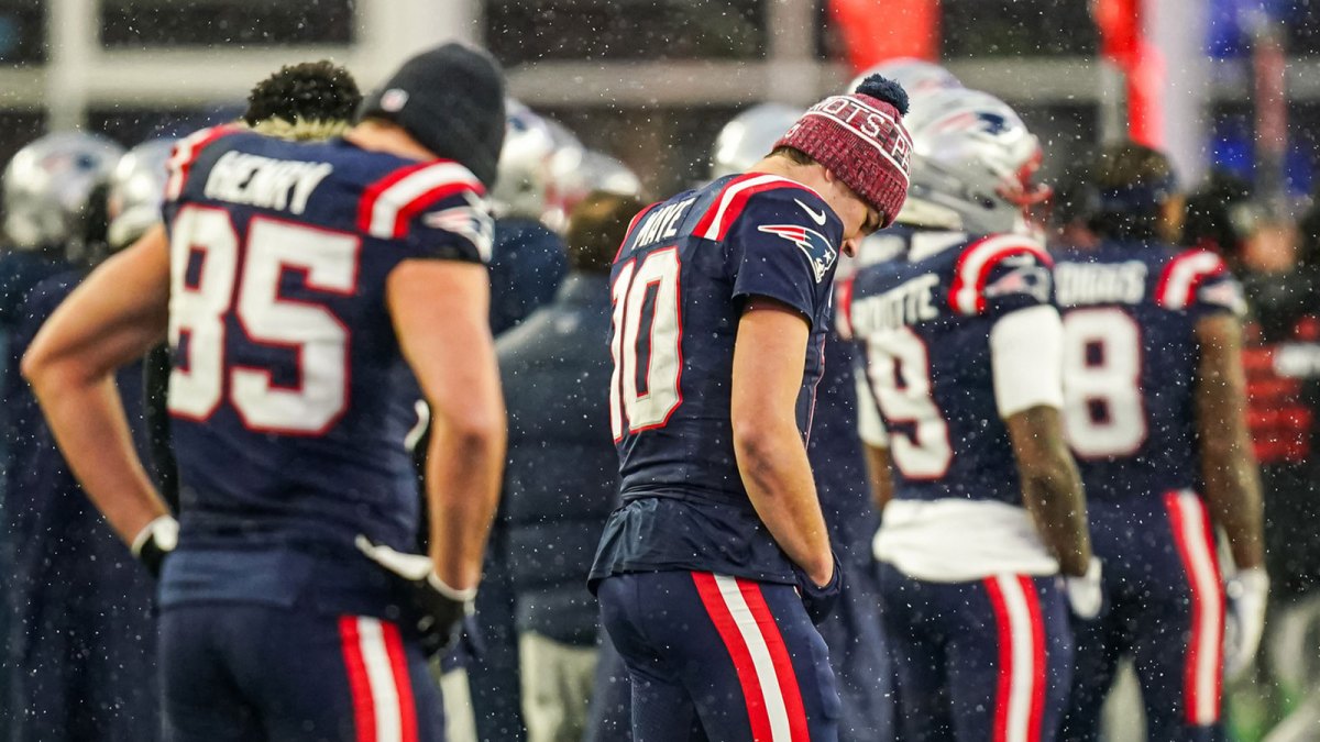 New England Patriots quarterback Drake Maye (10) and tight end Hunter Henry (85) on the sideline at the end of the game against the Buffalo Bills at Gillette Stadium.