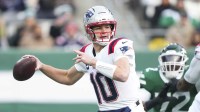 New England Patriots quarterback Drake Maye (10) passes against the New York Jets during the first quarter of the game at MetLife Stadium.