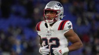 New England Patriots running back Treveyon Henderson (32) warms up prior to the game against the Baltimore Ravens at M&T Bank Stadium. Mandatory Credit: James Lang-Imagn Images