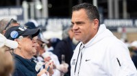 Penn State athletic director Pat Kraft talks with members of an alumni group outside of Beaver Stadium before an NCAA football game against Michigan