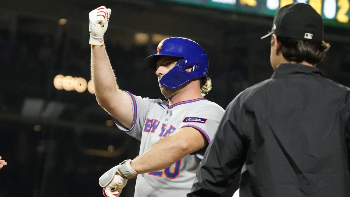 New York Mets first base Pete Alonso (20) reacts after hitting a RBI single against the Chicago Cubs during the sixth inning at Wrigley Field.