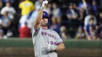 New York Mets first base Pete Alonso (20) gestures after hitting a double against the Chicago Cubs during the first inning at Wrigley Field.
