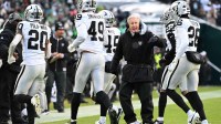 Las Vegas Raiders Head Coach Pete Carroll talks with players on the sidelines during the first quarter against the Philadelphia Eagles at Lincoln Financial Field