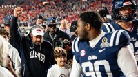 Ole Miss Head Coach Pete Golding raises a fist as he leaves the field after winning the first round of the College Football Playoff against Tulane at Vaught-Hemingway Stadium in Oxford, Miss., on Saturday, Dec. 20, 2025.