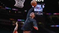Denver Nuggets guard Peyton Watson (8) dunks before a game against the Atlanta Hawks at State Farm Arena.
