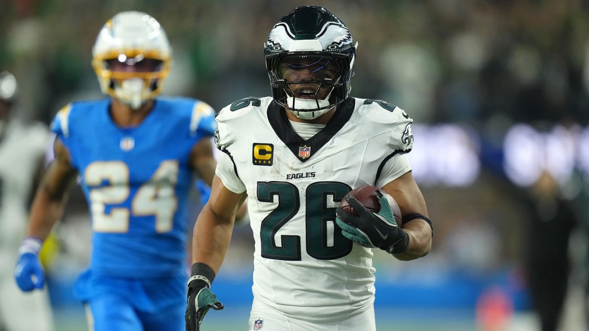 Philadelphia Eagles running back Saquon Barkley (26) runs to score a touchdown against the Los Angeles Chargers in the second half at SoFi Stadium.