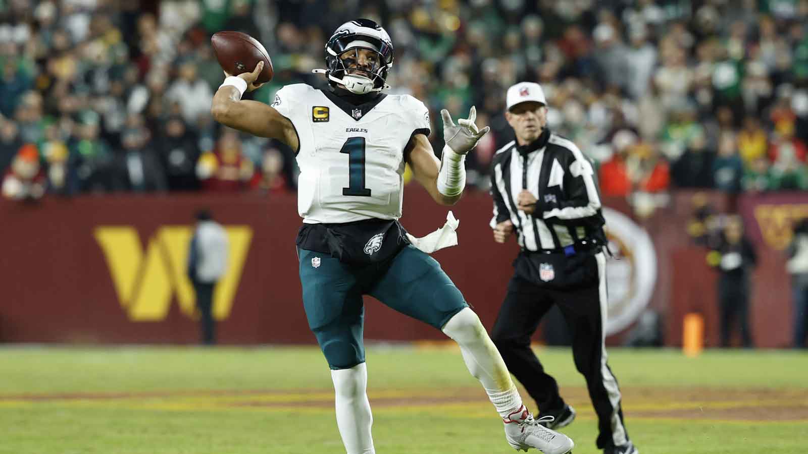Philadelphia Eagles quarterback Jalen Hurts (1) passes against the Washington Commanders in the second half at Northwest Stadium.