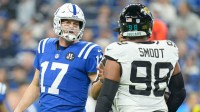 Indianapolis Colts quarterback Philip Rivers (17) and Jacksonville Jaguars defensive end Dawuane Smoot (98) exchange words.