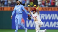Philadelphia Phillies first base Otto Kemp (4) reacts next to Kansas City Royals second base Jonathan India (6) after hitting an RBI double during the fifth inning at Citizens Bank Park