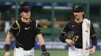 Pittsburgh Pirates catcher Henry Davis (32) and starting pitcher Bubba Chandler (57) walk in from the bullpen to play the Athletics at PNC Park.