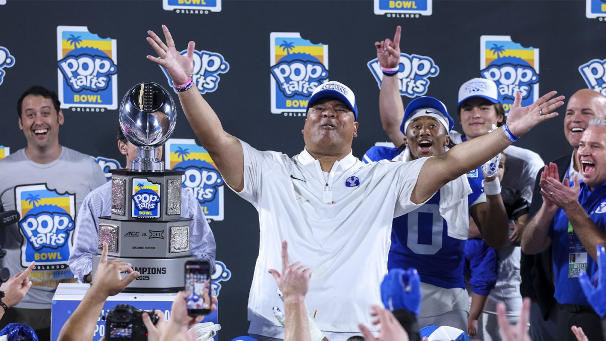 BYU Cougars head coach Kalani Sitake celebrates after beating Georgia Tech Yellow Jackets in the Pop-Tarts Bowl at Camping World Stadium.