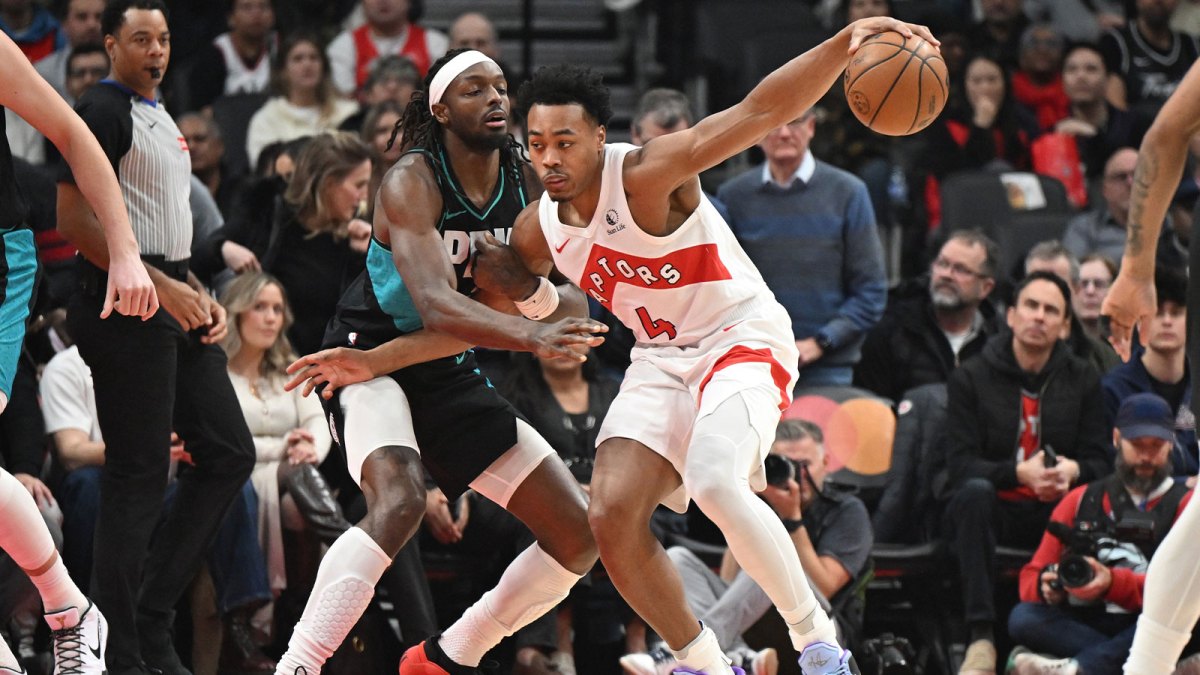 Toronto Raptors forward Scottie Barnes (4) tries to move the ball past Portland Trail Blazers forward Jerami Grant (9) in the first half at Scotiabank Arena.