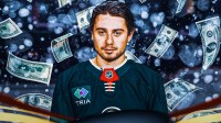 Minnesota Wild defenseman Quinn Hughes standing in a snowstorm of money.