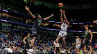 San Antonio Spurs forward Harrison Barnes (40) shoots a jump shot against New Orleans Pelicans center Derik Queen (22) during the first half at Smoothie King Center.