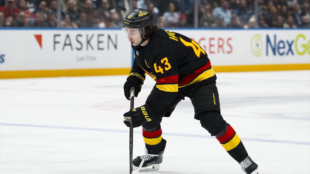 Vancouver Canucks defenseman Quinn Hughes (43) handles the puck against the Detroit Red Wings in the second period at Rogers Arena.