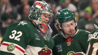 Minnesota Wild goalie Filip Gustavsson (32) and defensemen Quinn Hughes (43) celebrate a victory over the Boston Bruins at Grand Casino Arena.