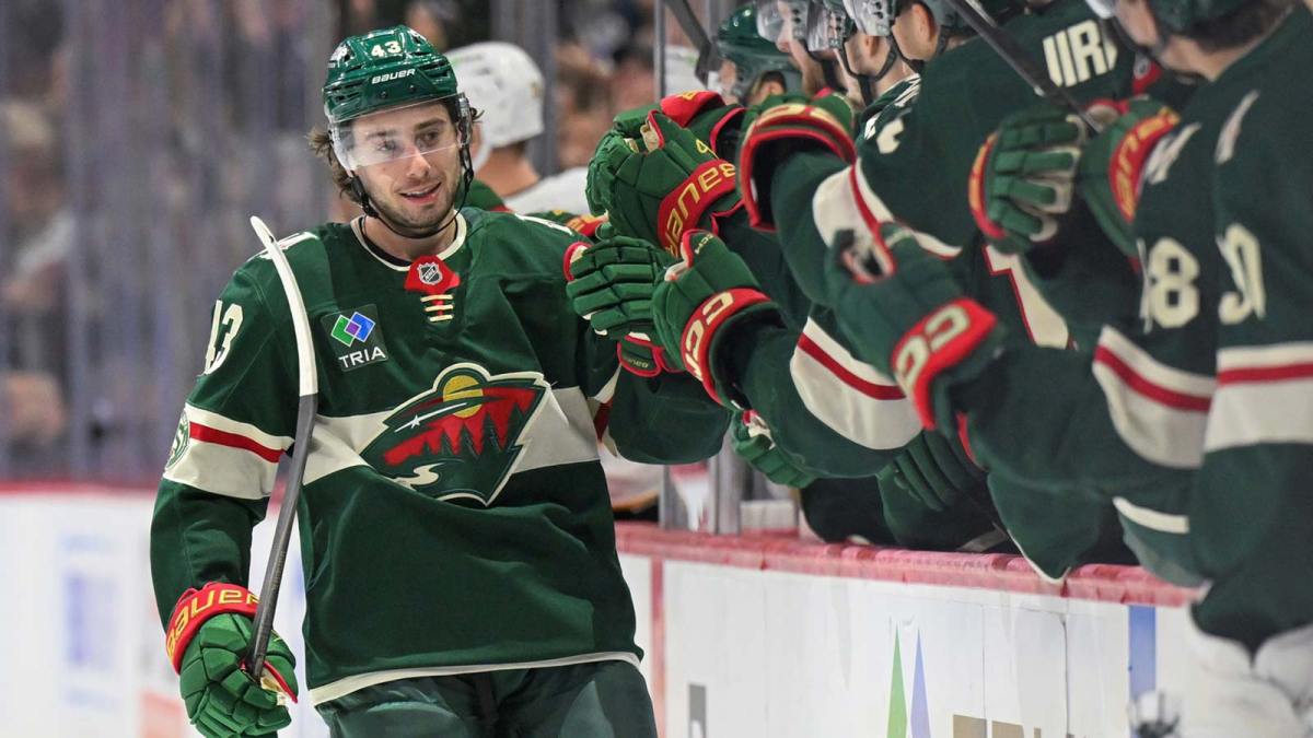 Minnesota Wild defensemen Quinn Hughes (43) celebrates after scoring a goal against the Boston Bruins during the third period at Grand Casino Arena.