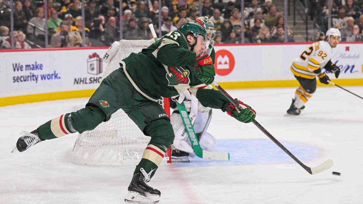 Minnesota Wild defensemen Quinn Hughes (43) makes a pass against the Boston Bruins during the first period at Grand Casino Arena