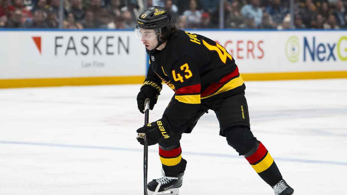 Vancouver Canucks defenseman Quinn Hughes (43) handles the puck against the Detroit Red Wings in the second period at Rogers Arena.