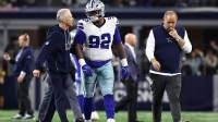 Dallas Cowboys defensive tackle Quinnen Williams (92) walks off the field with trainers after an injury during the second half against the Minnesota Vikings at AT&T Stadium.