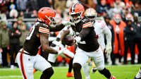 Cleveland Browns quarterback Shedeur Sanders (12) hands off the ball to Cleveland Browns running back Quinshon Judkins (10) during the first half against the San Francisco 49ers at Huntington Bank Field.