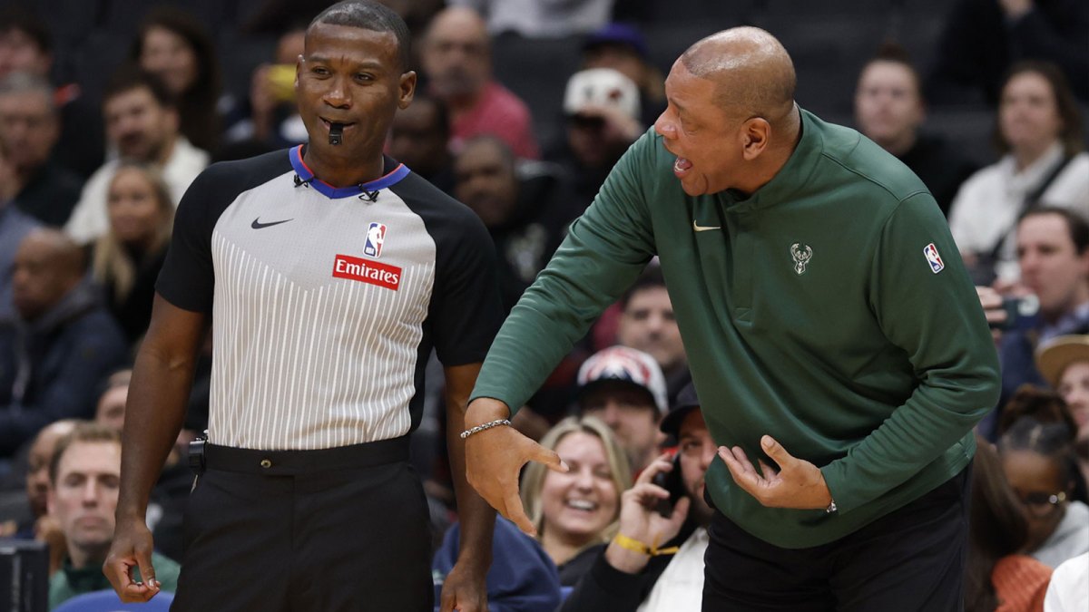 Milwaukee Bucks head coach Doc Rivers (R) argues with referee James Williams (60) against the Washington Wizards in the first quarter at Capital One Arena.
