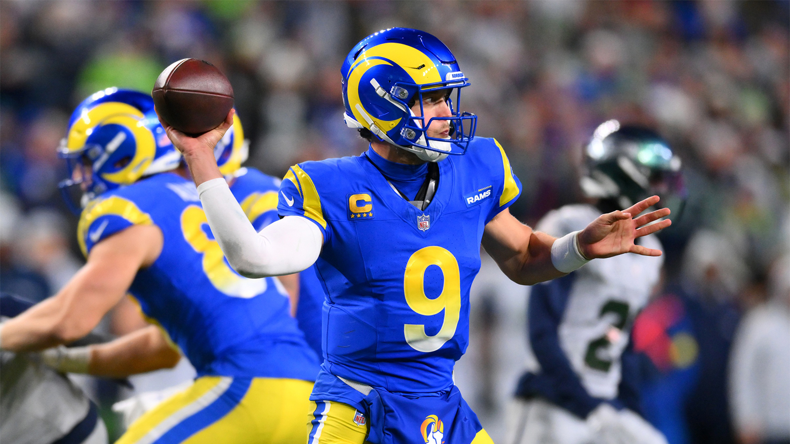Seattle Seahawks quarterback Sam Darnold (14) throws a pass against the Los Angeles Rams in the second half at Lumen Field.