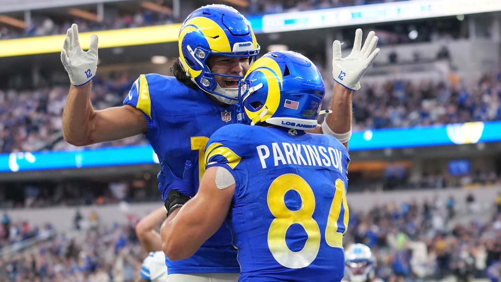 Los Angeles Rams wide receiver Puka Nacua (12) and Los Angeles Rams tight end Colby Parkinson (84) celebrate after a touchdown during the third quarter against the Detroit Lions at SoFi Stadium.