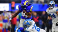 Los Angeles Rams wide receiver Davante Adams (17) runs after a catch against Detroit Lions safety Daniel Thomas (2) during the third quarter at SoFi Stadium.