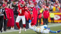 Kansas City Chiefs wide receiver Rashee Rice (4) runs with the ball against Los Angeles Chargers cornerback Benjamin St-Juste (24) during the first half at GEHA Field at Arrowhead Stadium.