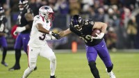 Baltimore Ravens tight end Mark Andrews (89) runs against New England Patriots safety Craig Woodson (31) during the first half of the game at M&T Bank Stadium.