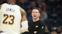 Los Angeles Lakers head coach JJ Redick (center) talks with forward LeBron James (23) during the third quarter against the Golden State Warriors at Chase Center.