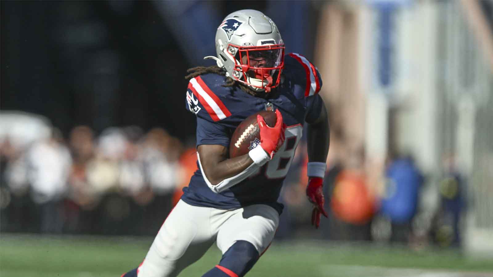 New England Patriots running back Rhamondre Stevenson (38) runs with the ball during the third quarter against the Cleveland Browns at Gillette Stadium. 
