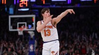 New York Knicks guard Tyler Kolek (13) reacts after making a three point basket during the second half against the Cleveland Cavaliers at Madison Square Garden.