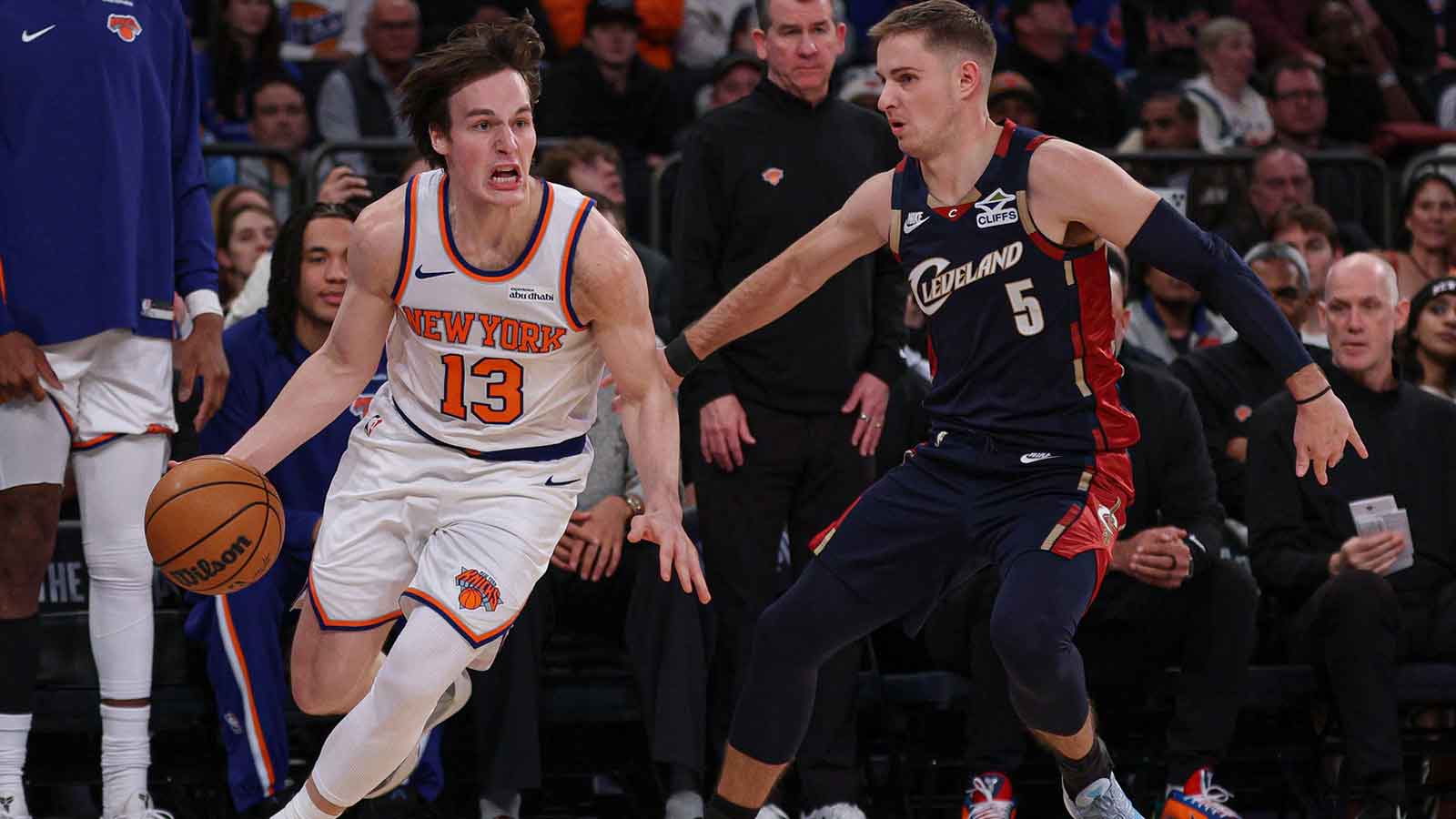 New York Knicks guard Tyler Kolek (13) dribbles as Cleveland Cavaliers guard Sam Merrill (5) defends during the second half at Madison Square Garden.