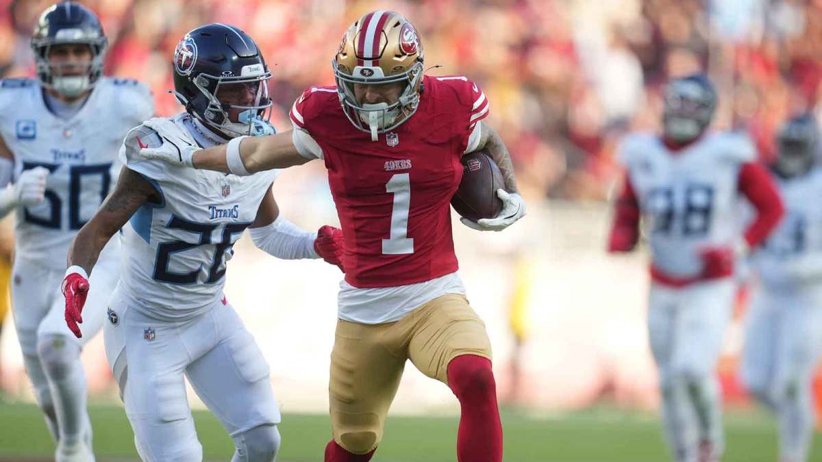 San Francisco 49ers wide receiver Ricky Pearsall (1) stiff arms Tennessee Titans cornerback Marcus Harris (26) during the third quarter at Levi's Stadium.