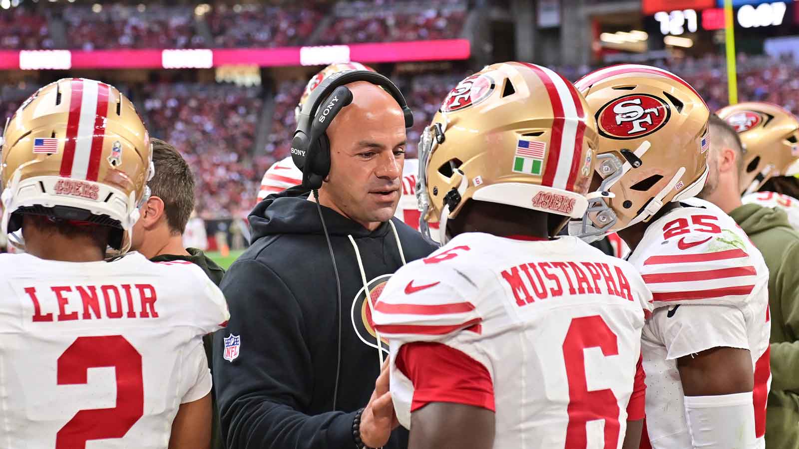 San Francisco 49ers defensive coordinator Robert Saleh speaks with 49ers safety Malik Mustapha (6) in the third quarter against the Arizona Cardinals at State Farm Stadium.