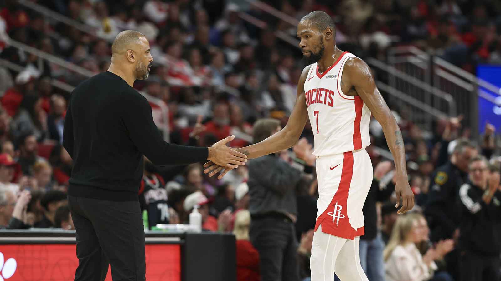 Rockets forward Kevin Durant (7) shakes hands with head coach Ime Udoka during the third quarter against the Phoenix Suns at Toyota Center