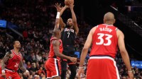 Houston Rockets forward Kevin Durant (7) shoots the ball over Los Angeles Clippers guard Kris Dunn (8) during the second half at Intuit Dome
