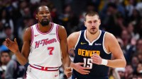 Houston Rockets forward Kevin Durant (7) and Denver Nuggets center Nikola Jokic (15) during the second quarter at Ball Arena.
