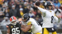 Cleveland Browns defensive end Myles Garrett (95) closes in on Pittsburgh Steelers quarterback Aaron Rodgers (8) during the first half of an NFL football game at Huntington Bank Field, Dec. 28, 2025, in Cleveland, Ohio.