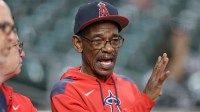 Los Angeles Angels manager Ron Washington (37) talks on the field before the game against the Houston Astros at Daikin Park.