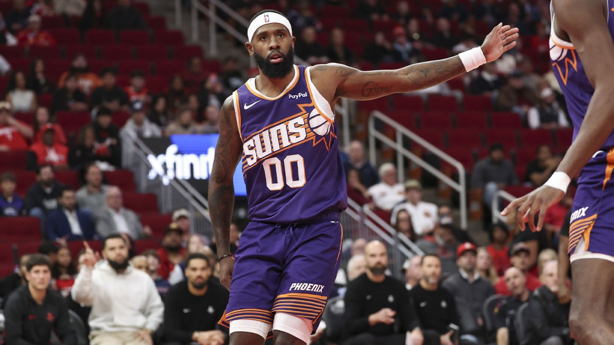 Phoenix Suns forward Royce O'Neale (00) reacts after a play during the first quarter against the Houston Rockets at Toyota Center.