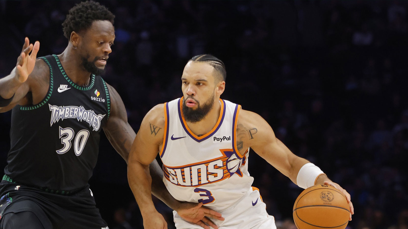 Phoenix Suns forward Dillon Brooks (3) works around Minnesota Timberwolves forward Julius Randle (30) in the first quarter at Target Center.