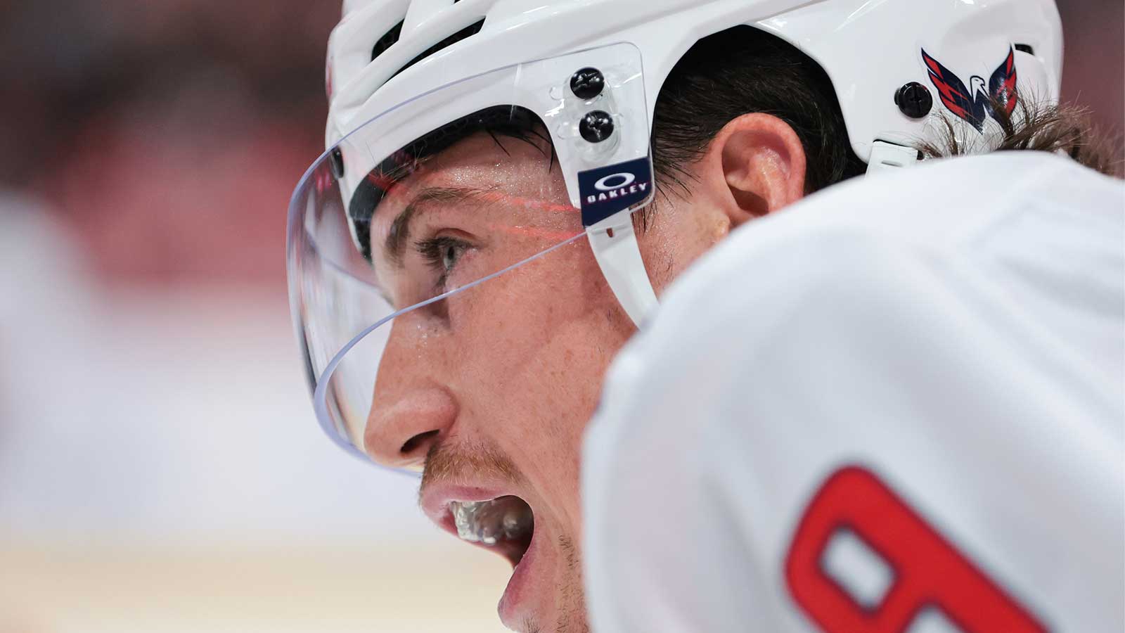 Washington Capitals right wing Ryan Leonard (9) speaks to Florida Panthers left wing Brad Marchand (not pictured) during the third period at Amerant Bank Arena